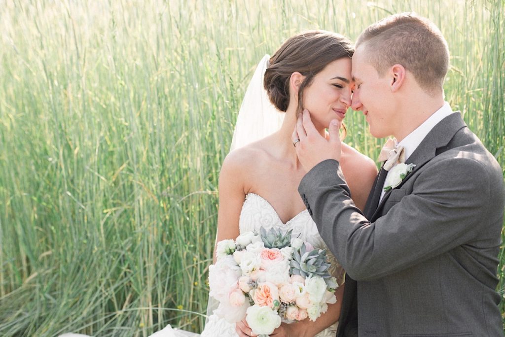 Bride and Groom with a blush bouquet by A Garden Party at a backyard wedding in New Jersey
