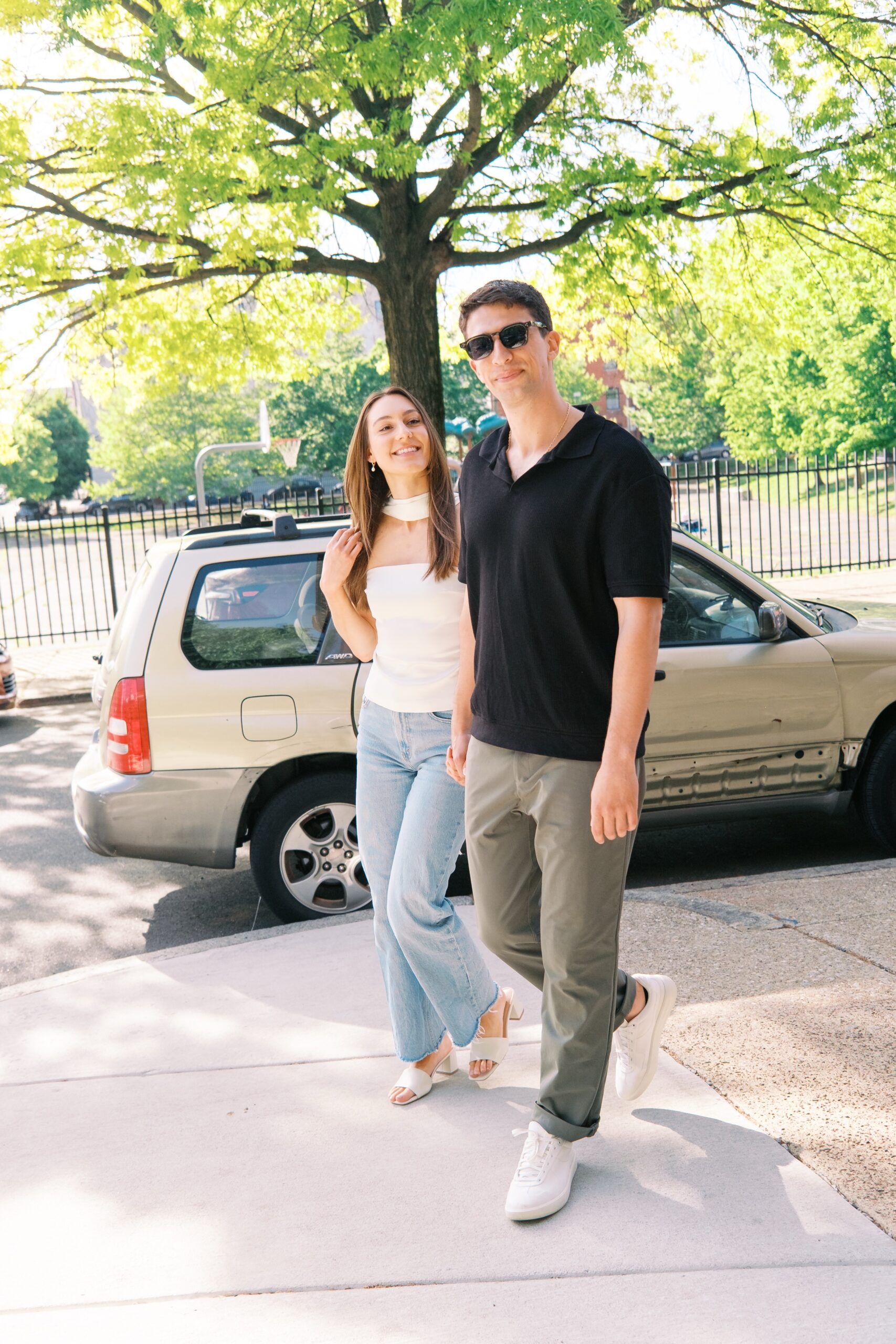 Engagement session couple walking in Fishtown
